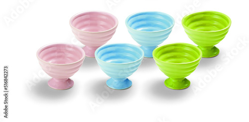 Set of six pink  blue and green grooved empty ceramic ice cream bowls  isolated on white