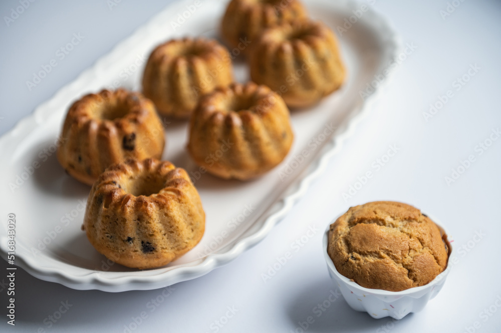Tasty muffins on nice plate on table at birthday party Tasty muffins on nice plate on table at birthday party