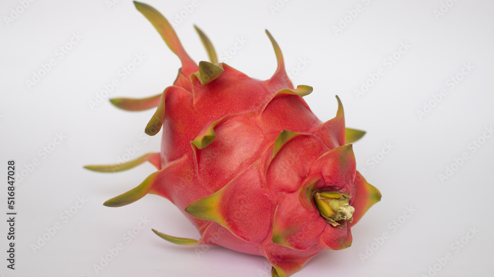 PITAHAYA OR DRAGON FRUIT WITH RED SKIN AND WHITE PULP ON A WHITE BACKGROUND PITAHAYA OR DRAGON FRUIT WITH RED SKIN AND WHITE PULP ON A WHITE BACKGROUND