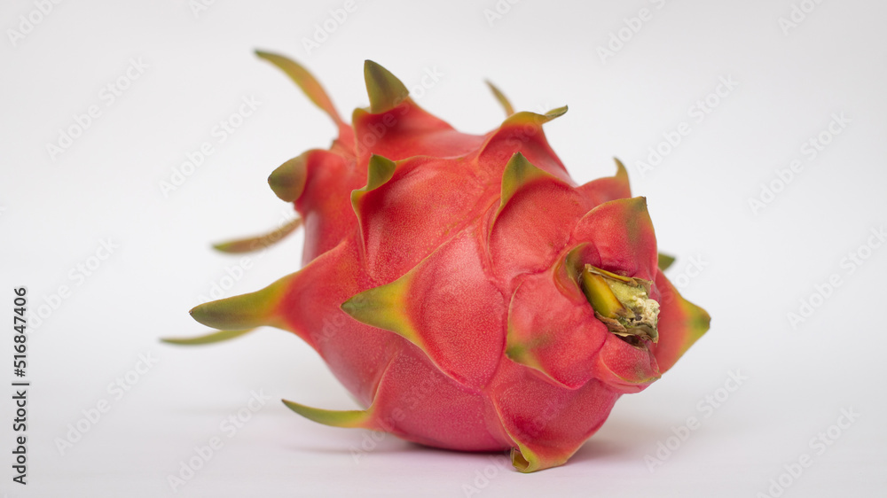 PITAHAYA OR DRAGON FRUIT WITH RED SKIN AND WHITE PULP ON A WHITE BACKGROUND PITAHAYA OR DRAGON FRUIT WITH RED SKIN AND WHITE PULP ON A WHITE BACKGROUND