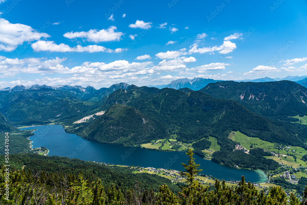 Stunning aerial panorama view of Grundlsee lake from Trisselwand with peaks of Styrian Alps in background on a sunny summer day, Styria, Austria