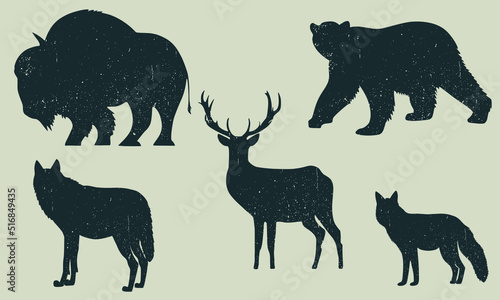 Vector image of silhouettes of wild animals. Vintage style. Image bear, elk, wolf, fox, bison.
