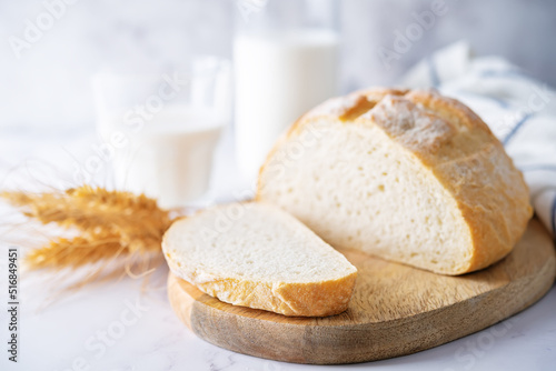 Wheat white bread with glasses of milk
