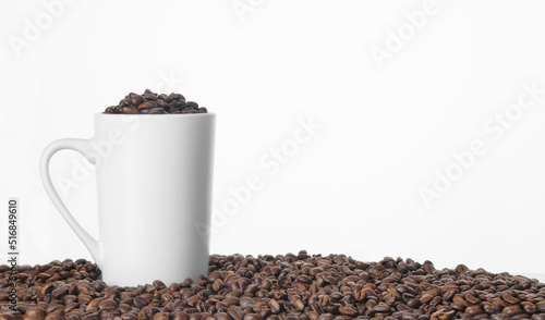 Cup of Coffee Beans on Fresh Coffee Beans Background with copy space