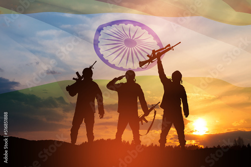 Silhouettes of soldiers on a background of India flag and the sunset or the sunrise. Greeting card for Independence day  Republic Day. India celebration.