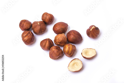 hazelnuts lie on a white background