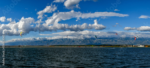 kite surfers on summer beach