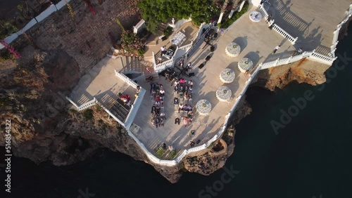 Top view of wedding ceremony on the cliff. Drone aerial view