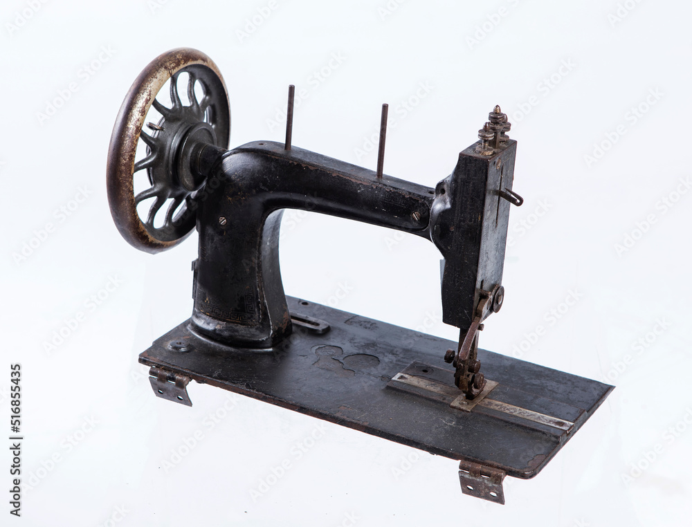 Vintage sewing machine isolated on white
