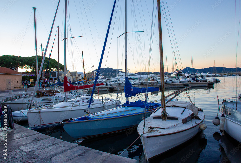 Luxury Sailboats in harbor in Saint-Tropez , sunset