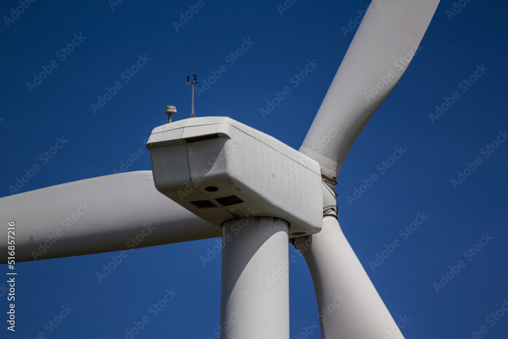 wind turbine against blue sky wind turbine against blue sky