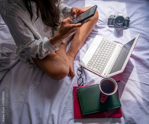 relaxed businesswoman working on her computer with her coffee
