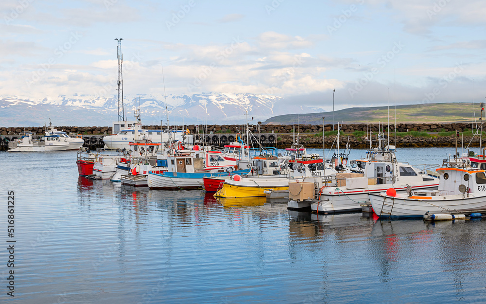 Harbors at Reykjavis, Iceland, with snowy mountains as background, under cloudy day Harbors at Reykjavis, Iceland, with snowy mountains as background, under cloudy day