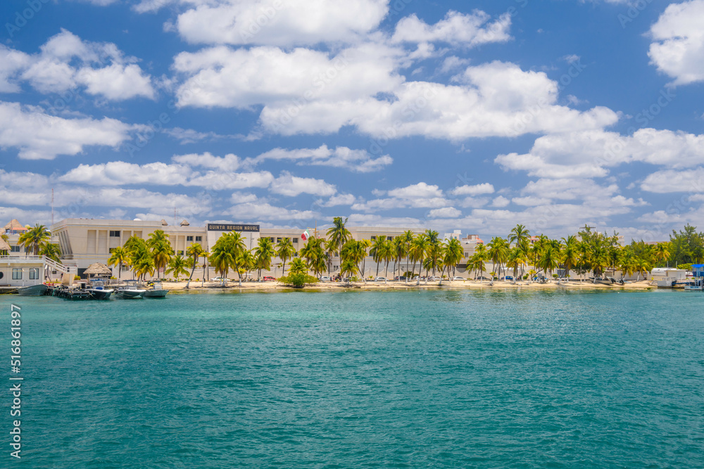 Boats near the coast with palms of Isla Mujeres island in Caribbean Sea, Cancun, Yucatan, Mexico
