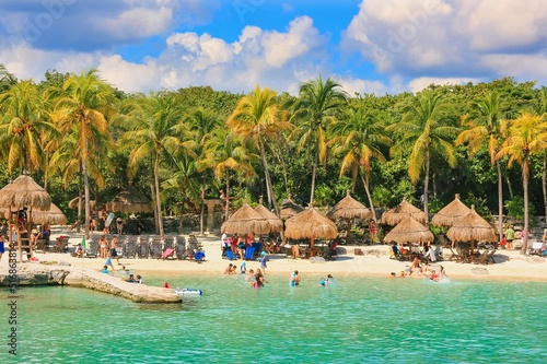 Scenic view to caribbean nature and paradise beach in Xcaret Eco Park near Mayan civilization ruins archaeological site. Eco tourism, family vacation concept.Yucatan, Mexico photo