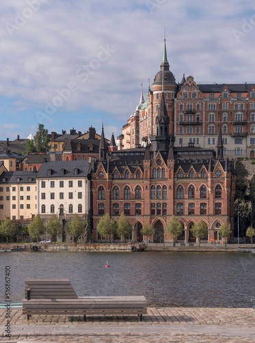 Old 1800s houses at the water front in the block at the street Bastugatan, a sunny summer day in Stockholm photo