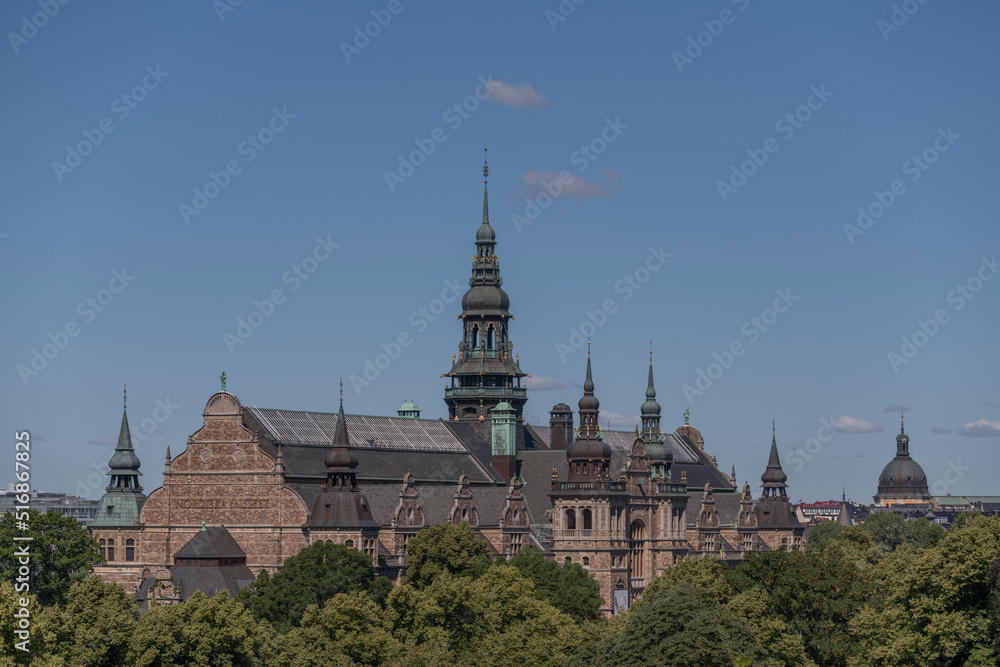 Old gothic stone museum building with towers and spires, a sunny summer day in Stockholm