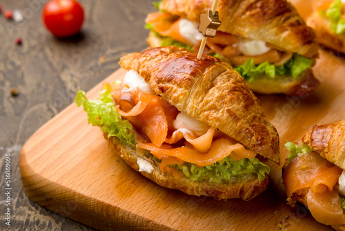 mini croissant with salmon and cheese with mix salad, canapes