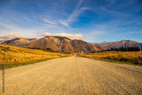 Gravel road in remote rural Coleridge area of the rugged dramatic foothills of the Southern Alps photo