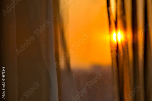 Curtains in sunset ray