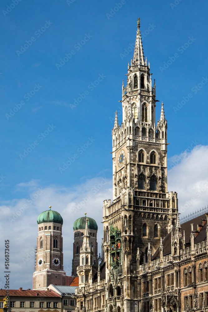 travel germany and bavaria, view at the city hall of Munich, Bavaria, Germany, the two towers of the Frauenkirche in the background 