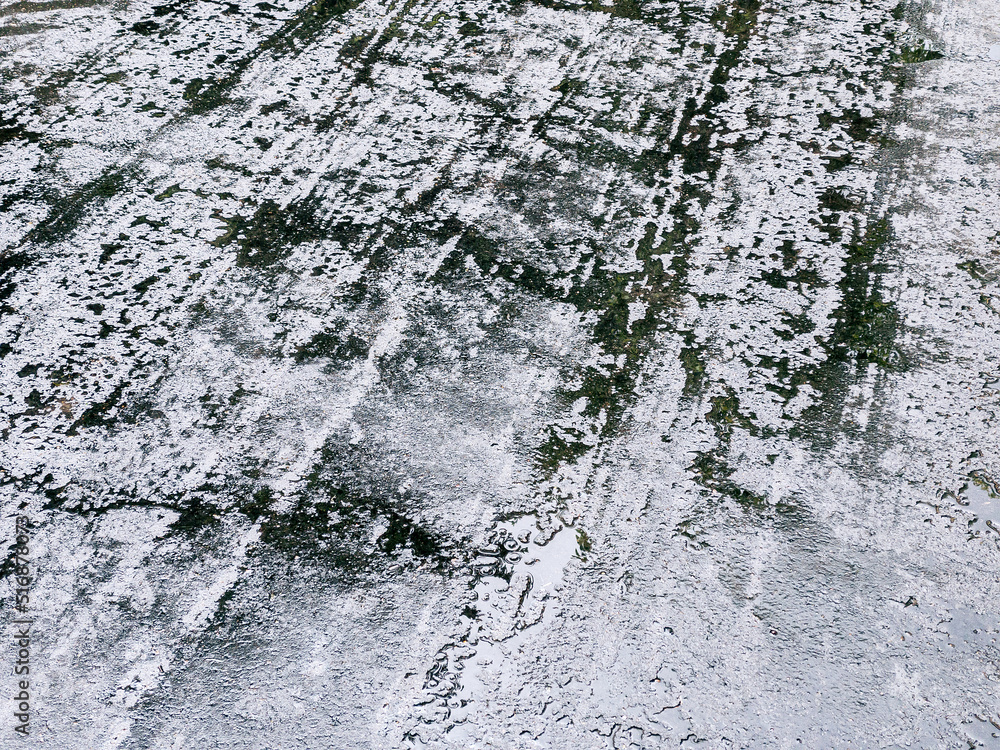 wet dark asphalt with raindrops. sidewalk with puddles of water. wet dark asphalt with raindrops. sidewalk with puddles of water.