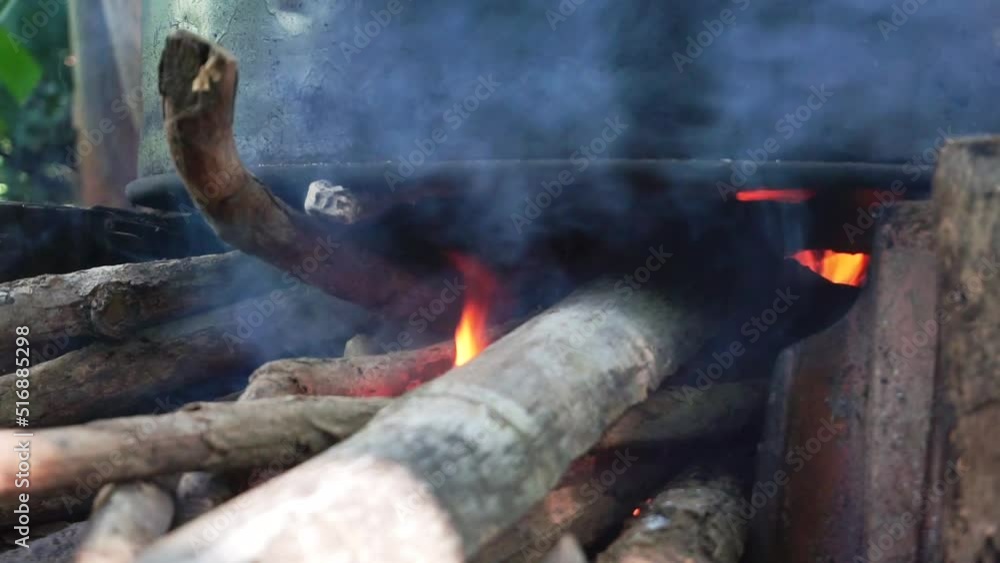 Traditional stove with wood that is burned in it and gives off a fire. Traditional stove with wood that is burned in it and gives off a fire.