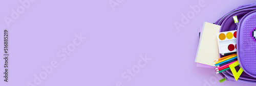 Back to school concept. Backpack with school supplies. Top view.