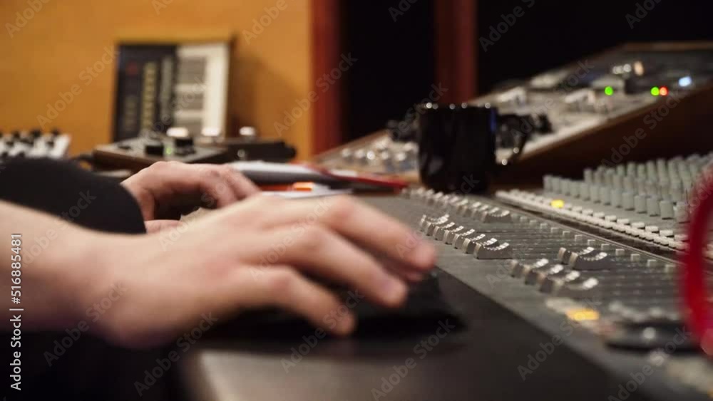 Man Working In The Music Recording Studio With Console. - close up Man Working In The Music Recording Studio With Console. - close up