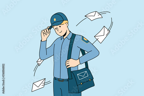 Smiling postman in uniform with bag full of post to deliver. Happy young mailman delivering letters to receivers. Postal service. Vector illustration. 