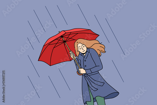 Unhappy young woman going under umbrella on rainy day. Upset stressed girl walk outside on cold bad weather in storm and thunderstorm. Vector illustration. 