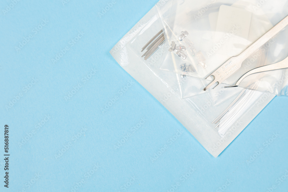 a set of special tools for an orthodontist to install braces for a patient. Orthodontic arcs, ligature, locks, positioner, tweezers a set of special tools for an orthodontist to install braces for a patient. Orthodontic arcs, ligature, locks, positioner, tweezers