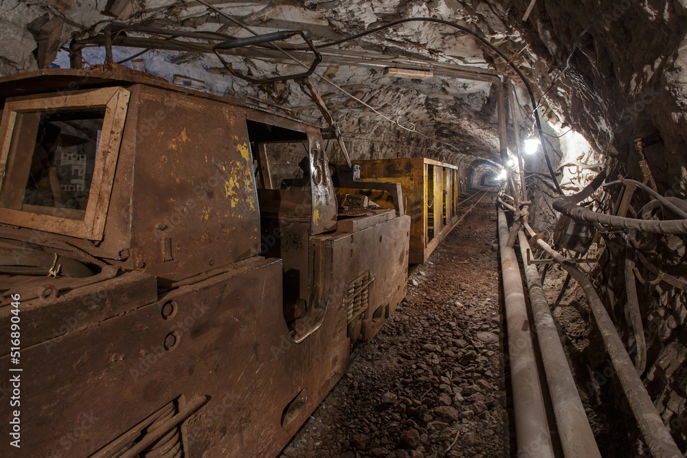 Naklejka premium Old rusty train in iron ore mine