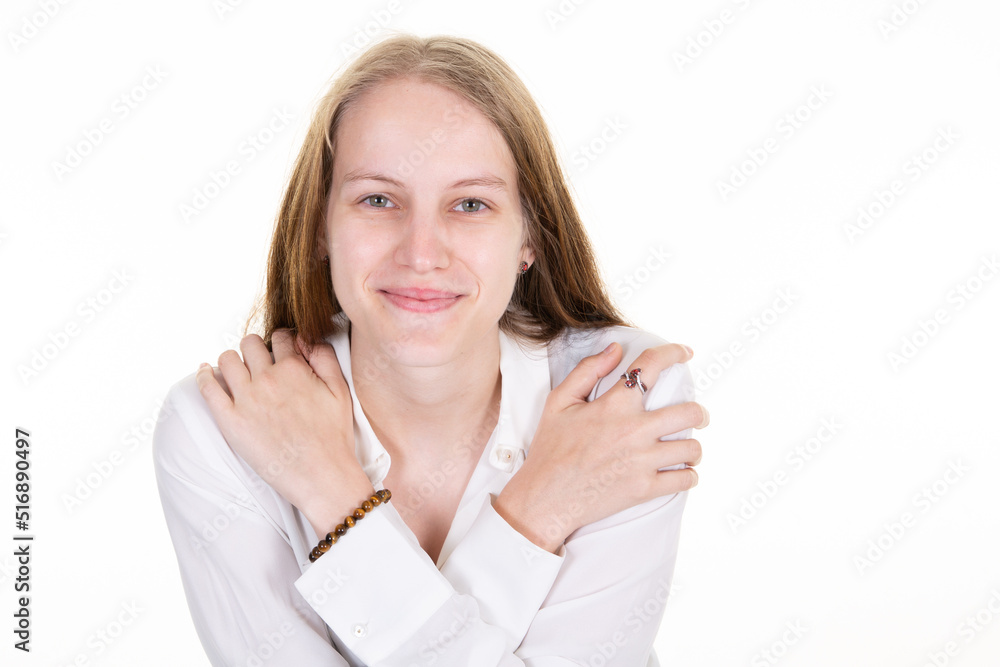 Beautiful smile happy blonde woman posing arms crossed in studio wall white background Beautiful smile happy blonde woman posing arms crossed in studio wall white background