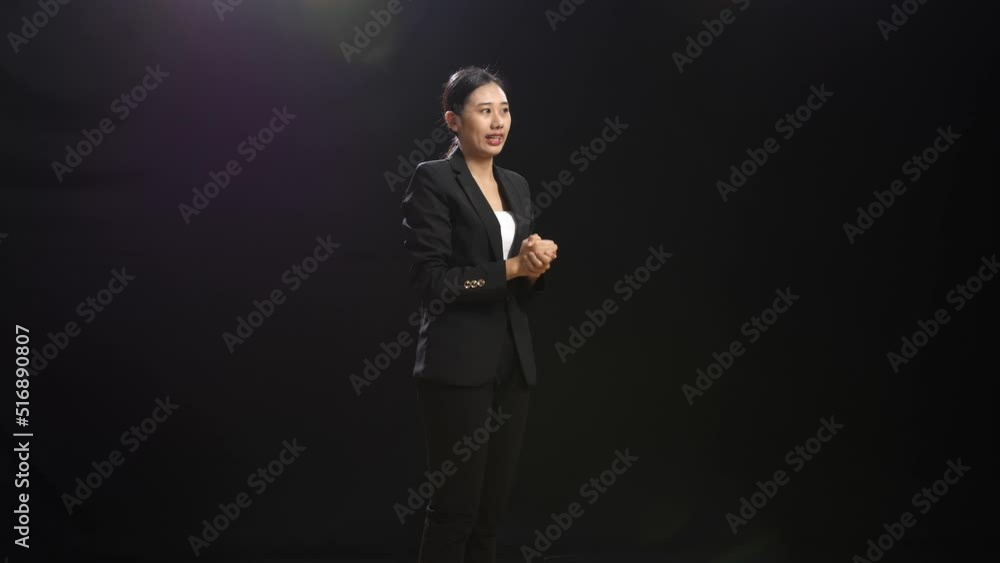 Side View Of Smiling Asian Speaker Woman In Business Suit Clapping Her Hands And Looking Around While Standing In The Black Screen Studio
Side View Of Smiling Asian Speaker Woman In Business Suit Clapping Her Hands And Looking Around While Standing In The Black Screen Studio