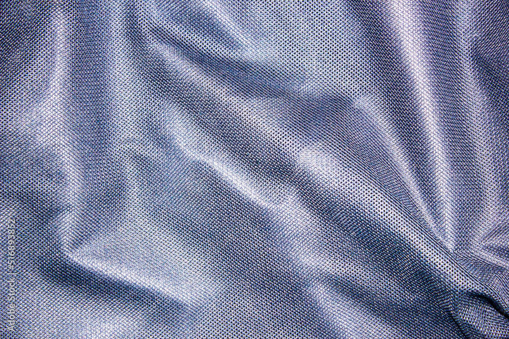 Mesh dark blue fabric lining in clothes. Dark fabric in a mesh high