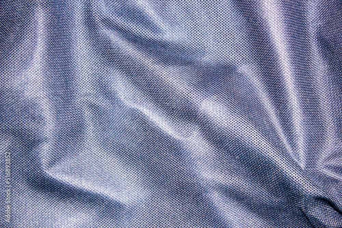 Mesh dark blue fabric lining in clothes. Dark fabric in a mesh high-definition texture.