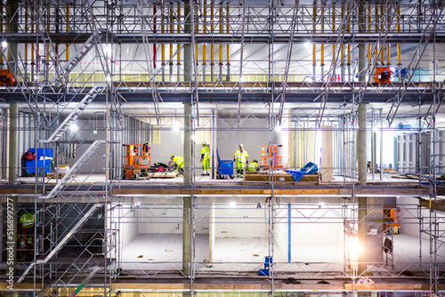 Workers on scaffolding at construction site