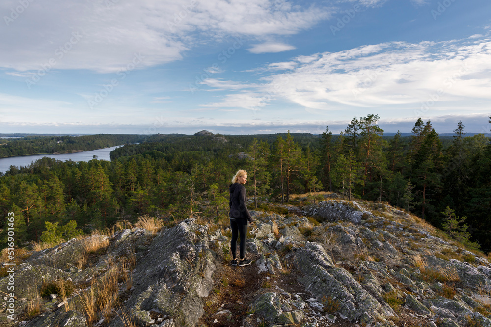 Woman hiking in Sorknatten Nature Reserve Sweden Woman hiking in Sorknatten Nature Reserve Sweden