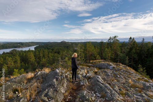 Woman hiking in Sorknatten Nature Reserve Sweden photo