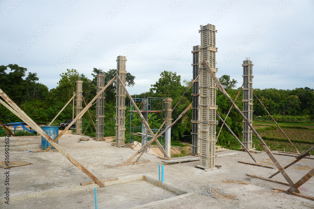 Concrete column formwork on the second floor of a building. Construction progress for periodic assessment.	
