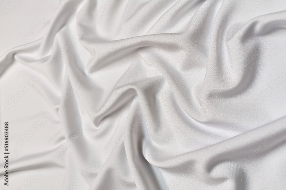 White supplex crumpled or wavy fabric texture background. Abstract linen cloth soft waves. Silk fabric. Smooth elegant luxury cloth texture. Concept for banner or advertisement. White supplex crumpled or wavy fabric texture background. Abstract linen cloth soft waves. Silk fabric. Smooth elegant luxury cloth texture. Concept for banner or advertisement.