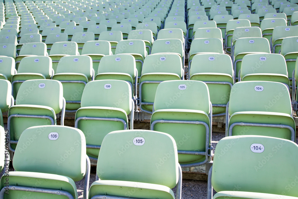 Fototapeta premium Empty Plastic Chairs at the Stadium