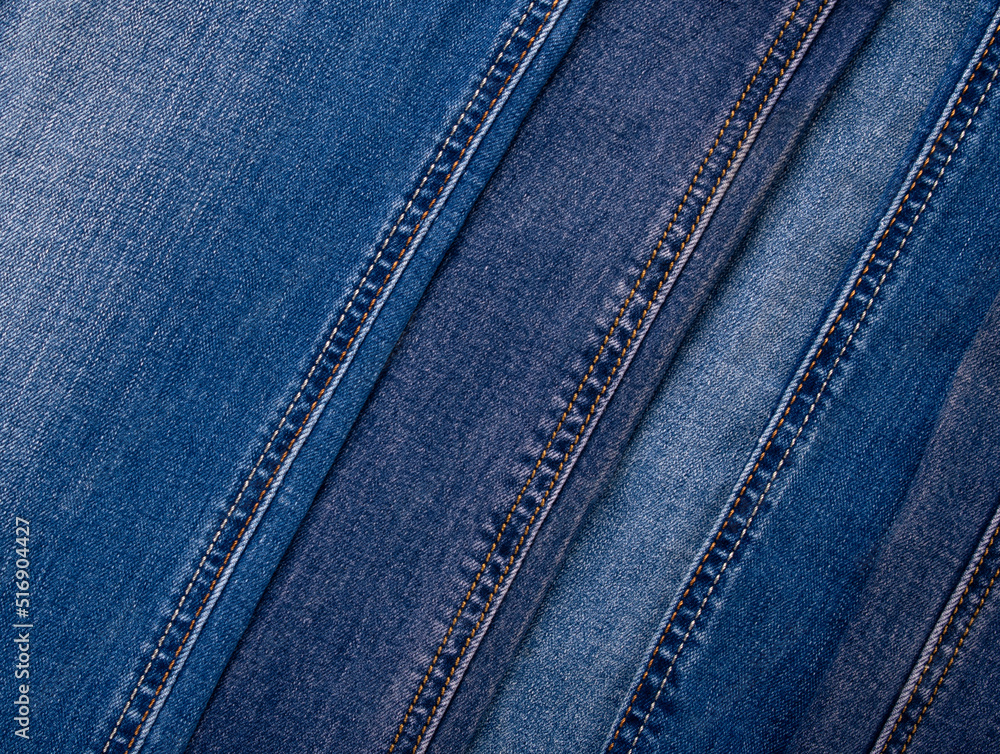 Assorted denim texture. Pile of jeans with seams. Top view. Full frame. Mockup with copy space Assorted denim texture. Pile of jeans with seams. Top view. Full frame. Mockup with copy space