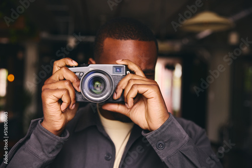 Photographer Taking A Picture With Camera Looking Through Lens