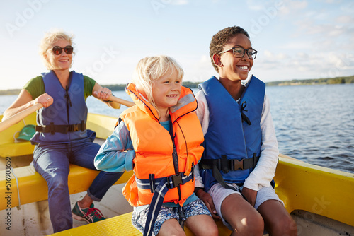 Family in boat on lake