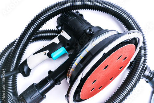 Rotary grinder with LED light and vacuum cleaner hose, isolate on white background