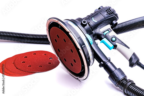 Vacuum grinder with replaceable abrasive discs isolated on white background