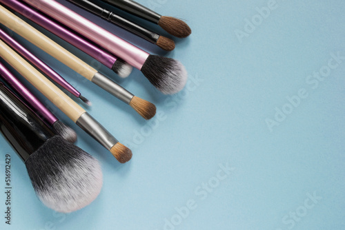 Makeup brushes on blue
