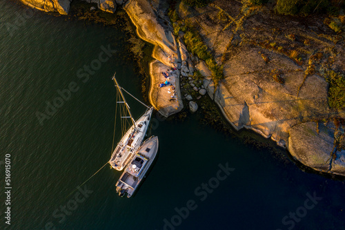 Boats moored at island in Stockholm Archipelago Sweden photo